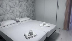 A hotel room with a large bed, two pillows, a headboard with a textured pattern, and a wardrobe. - Los Gigantes, Fantastic 1 Room, balcony (Acantilados de Los Gigantes)
