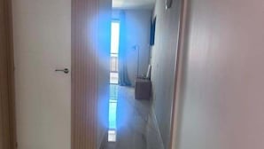A hallway with a door, a window, and a light fixture. - Los Gigantes, Fantastic 1 Room, balcony (Acantilados de Los Gigantes)