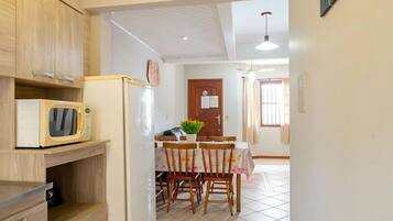Family Room | Private kitchen | Microwave, oven, cookware/dishes/utensils, cleaning supplies