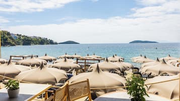 On the beach, beach cabanas, sun-loungers, beach umbrellas