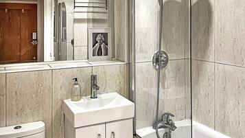 Bathtub, hair dryer, towels
