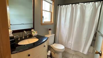Bathtub, hair dryer, towels