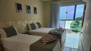 A hotel room with two beds, a large window with a view, and a balcony. - Pousada Tropical Maragogi (Maragogi)