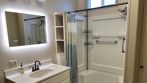 A bathroom with a white sink, mirror, and shower. - Cozy 2+bed/1bath in quiet neighborhood (Pomeroy)