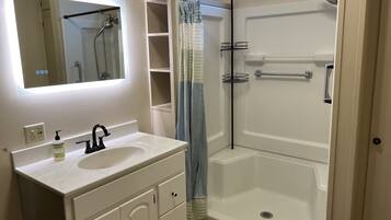 Shower, hair dryer, towels, soap