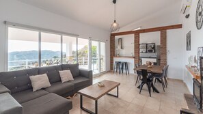 Enjoy a comfortable stay in this apartment with a spacious living area, compact kitchen, and dining space.