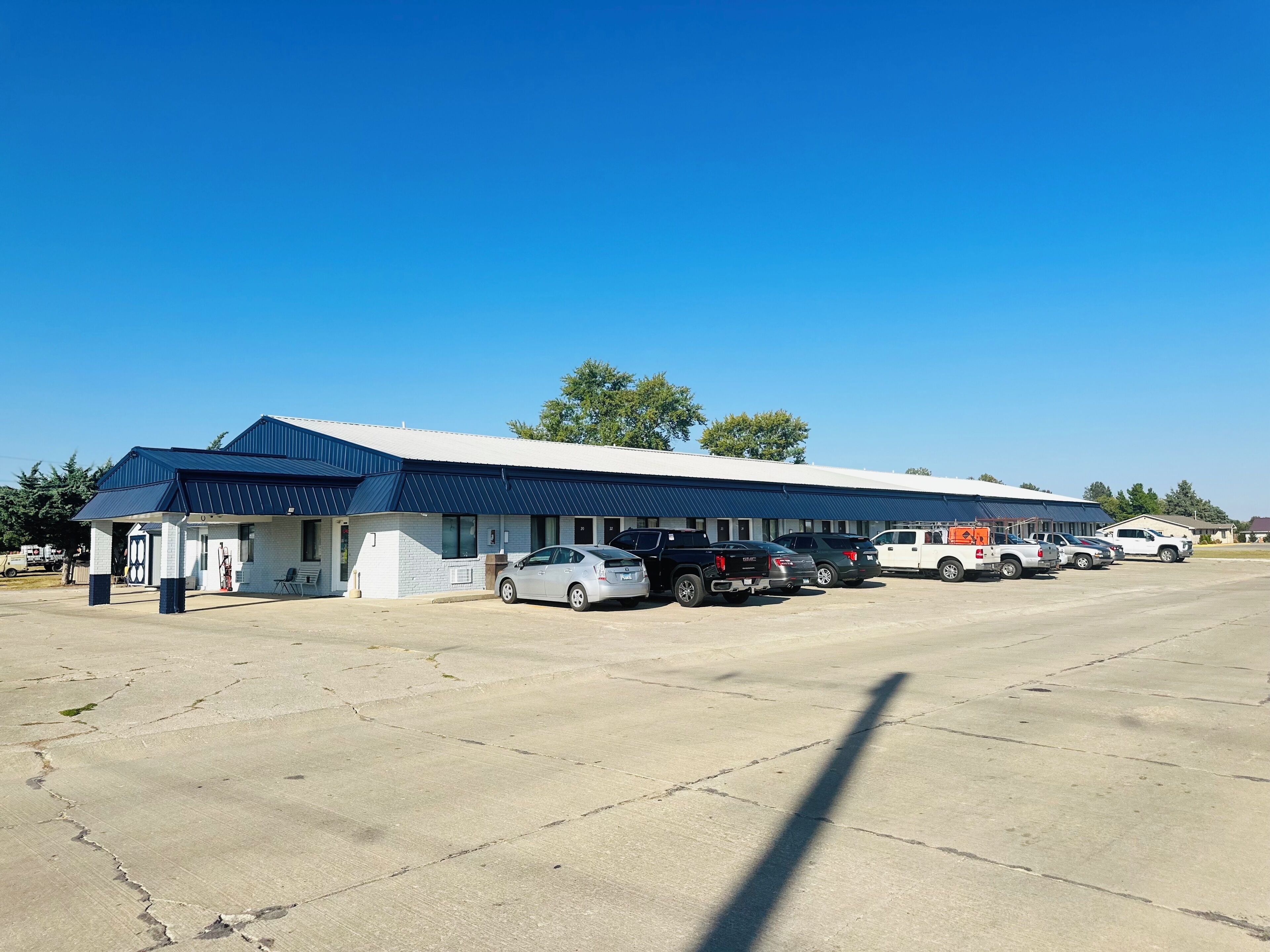 A large building with a covered parking area.
