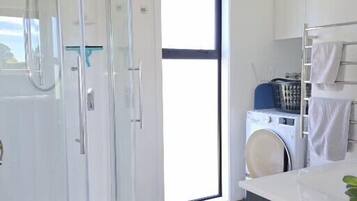 Shower, hair dryer, towels, soap