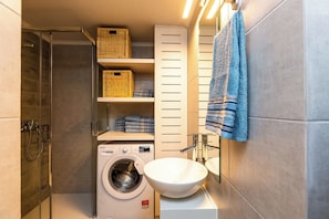 Shower, hair dryer, towels, soap