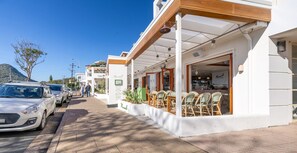 Stroll to the ground-floor cafe with outdoor seating and enjoy a meal amidst the vibrant street scene.