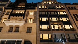 A multi-story building with a mix of architectural styles, including ornate detailing and modern elements. - Ruby Claire Hotel Geneva by IHG (Geneva)