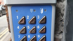 A blue and gray code lock with numbers 1-9, letters A-B, and a code lock label. - City Centre, Detached 10 Person Accommodation (Liverpool)