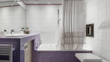 Bathtub, hair dryer, bidet, towels