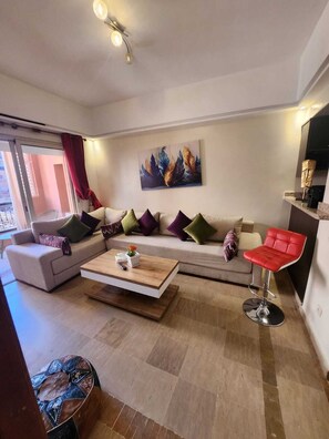 Comfort Apartment | Living area | 50-inch plasma TV with cable channels - Appartement PATIO GUELIZ (Marrakech)