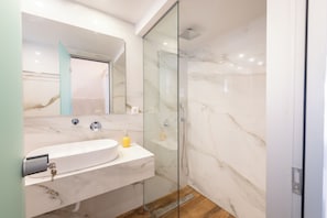 Shower, rainfall showerhead, hair dryer, towels