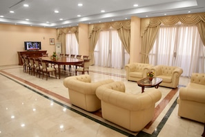 Presidential Suite | Living area | 60-inch LED TV with cable channels, TV, fireplace