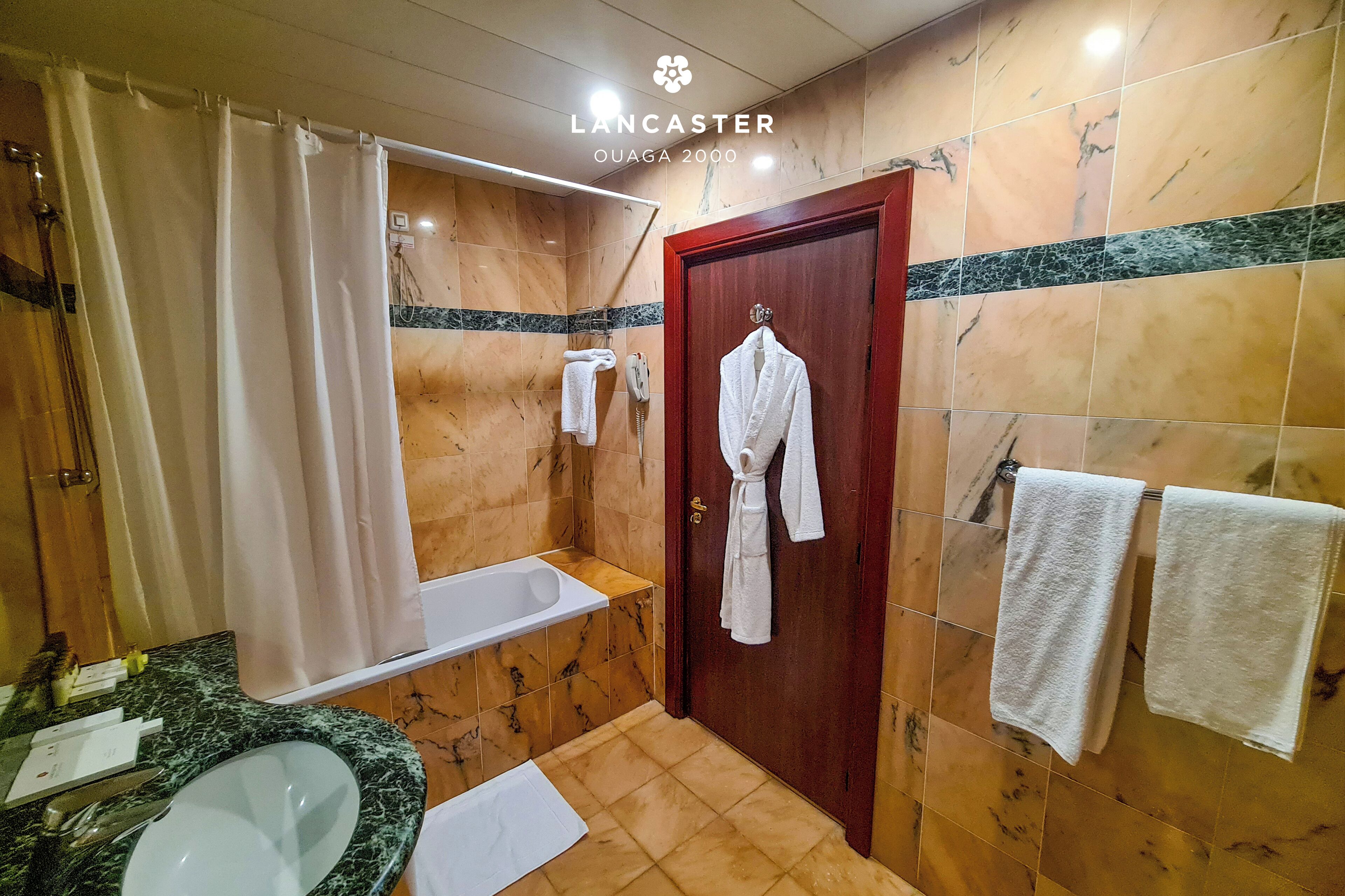 combined shower/bathtub, rainfall showerhead, hair dryer, bathrobes