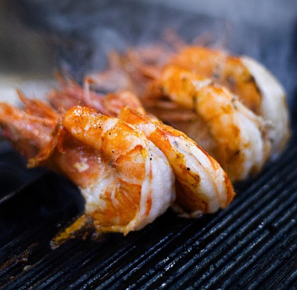 Grilled shrimp on a grill.
