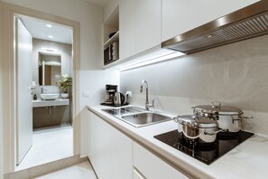Premium Suite, 1 Queen Bed with Sofa bed | Private kitchen | Fridge, microwave, stovetop, electric kettle