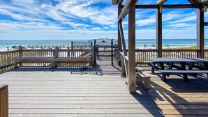 A wooden deck with a view of the beach and ocean. - Steps to Pvt beach/Beach ramp/2 pools/Sleeps 18 (Miramar Beach)