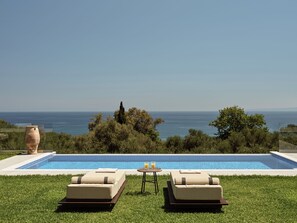 Outdoor pool, an infinity pool, pool loungers