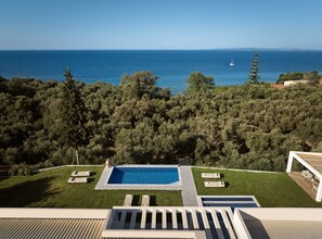 Outdoor pool, an infinity pool, pool loungers