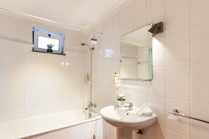 Bathtub, hair dryer, towels
