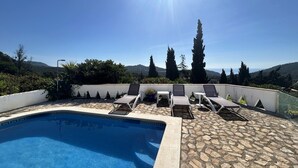 A rooftop pool with lounge chairs and a view of the surrounding landscape. - Holiday rental villa with swimming pool in Begur, Casa de Campo (Begur)
