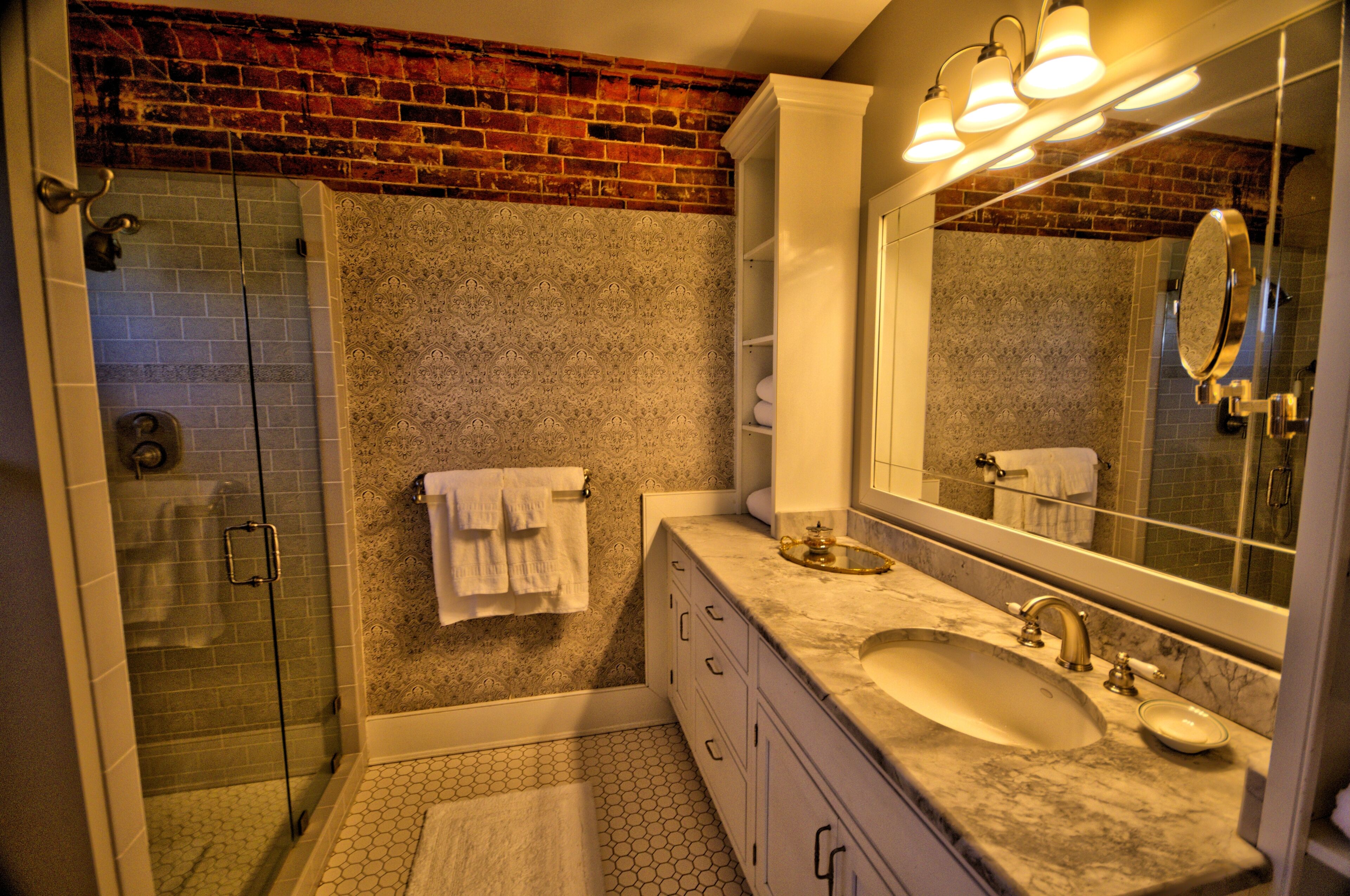 Combined shower/bathtub, towels, soap, shampoo