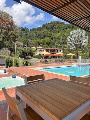 2 outdoor pools, open 9:00 AM to 9:00 PM, pool umbrellas, sun loungers
