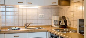 Comfortable vacation apartment on the North Sea with balcony and parking included - Hus