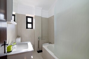 Bathtub, hair dryer, towels