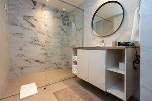 Shower, hair dryer, towels, soap