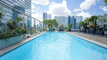 Outdoor pool, open 6:00 AM to 8:00 PM, pool loungers