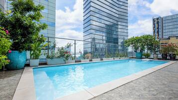 Outdoor pool, open 6:00 AM to 8:00 PM, pool loungers