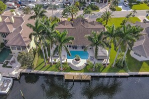 A large residential property with a swimming pool, multiple houses, and a dock. - Palms by the Sea Villa 🌊 Waterfront | Heated Pool | Near Beach 🏖️ (Fort Lauderdale)