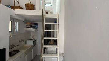 Traditional Studio Suite | Living area | Flat-screen TV