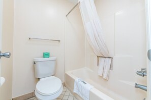Combined shower/tub, towels, soap, shampoo