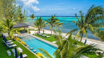 On the beach, sun-loungers, beach umbrellas, beach towels