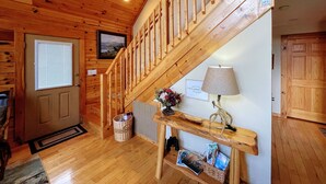 A wooden staircase leading to a loft bedroom with a view of the outdoors. - Spectacular year-round views of Smokey Mountain National Park from a D-Log Cabin (Whittier)