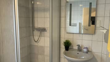 Shower, hair dryer, towels, toilet paper