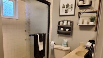 Shower, towels, soap, toilet paper