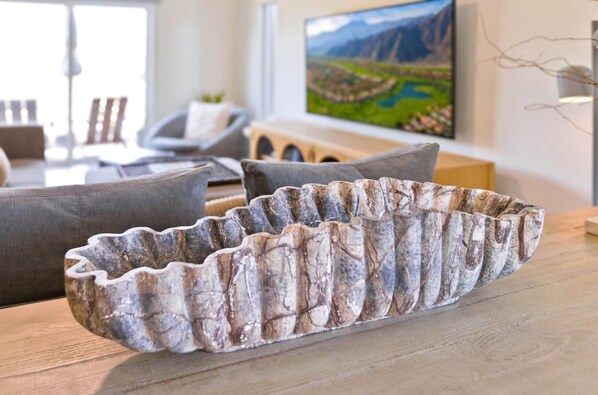 A modern living room with a wooden coffee table, grey sofas, and a painting on the wall. - Desert Retreat Relax, Recharge, Views, Resort Living, Office + Monthly Discount (Palm Springs)