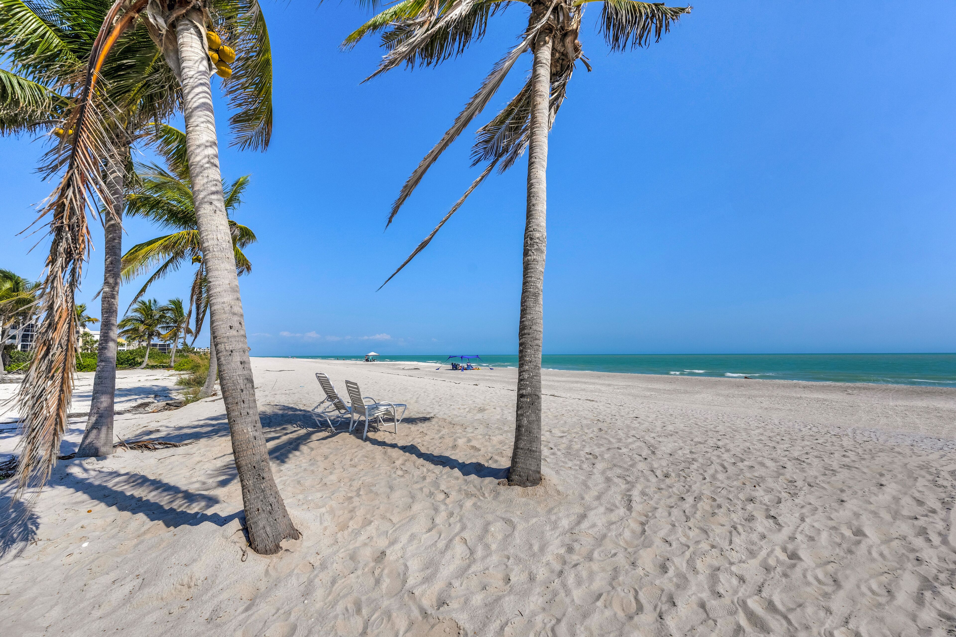 On the beach, sun loungers, beach towels