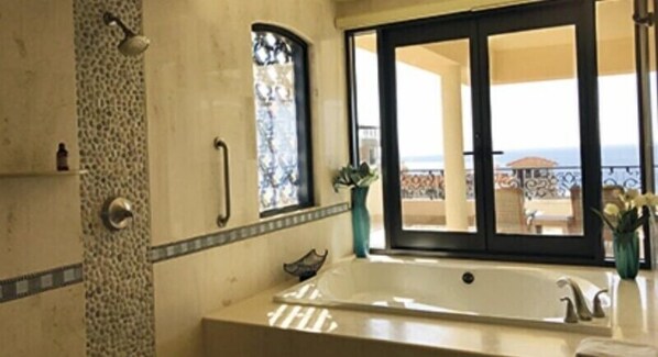 Bathtub, jetted bath, hair dryer, towels