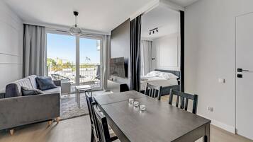 Executive-Apartment | Wohnbereich | Flachbildfernseher