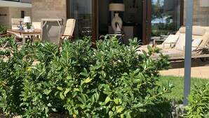 A modern outdoor seating area with a table, chairs, and a sofa. - Lakeside condo with beach access (Csopak)