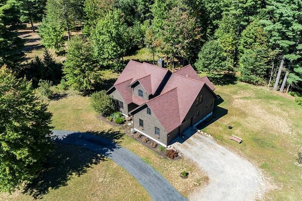 Birds eye view of the home boasting over 4000 Sq Ft of living space for guests to use with sleeping arrangements for up to 16 guests. Take a short walk to the back of the home and enjoy 460 ft on the Potash Brook. Minutes away from Whiteface mountain