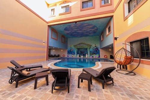 Outdoor pool, open 7:00 AM to 5:00 PM, sun loungers, lifeguards on site