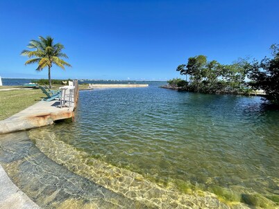 Old Florida Style, wrap around porch, boat basin for dockage, open water